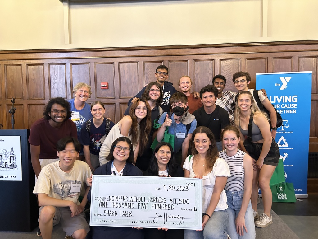 A group of EWB-UIUC members posing with a check for $1500